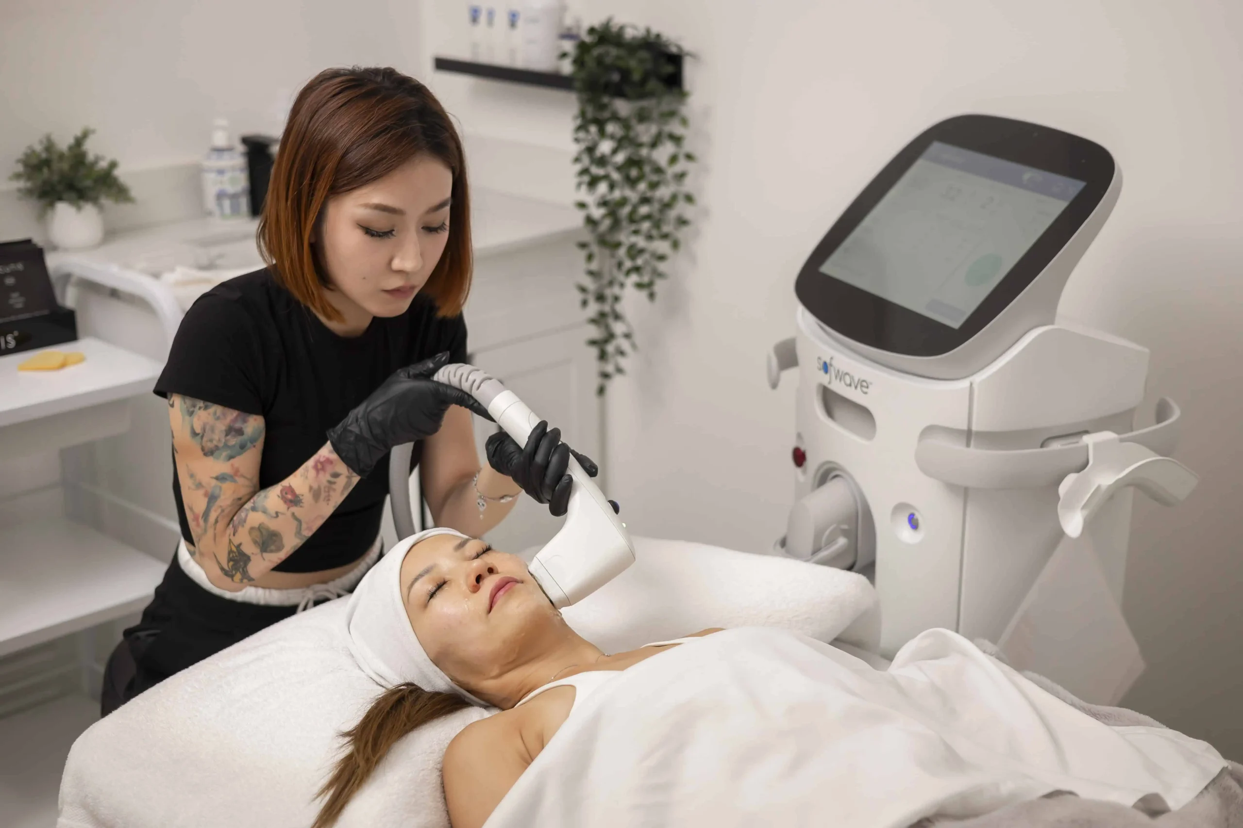 Laser facial procedure performed on woman wearing protective goggles