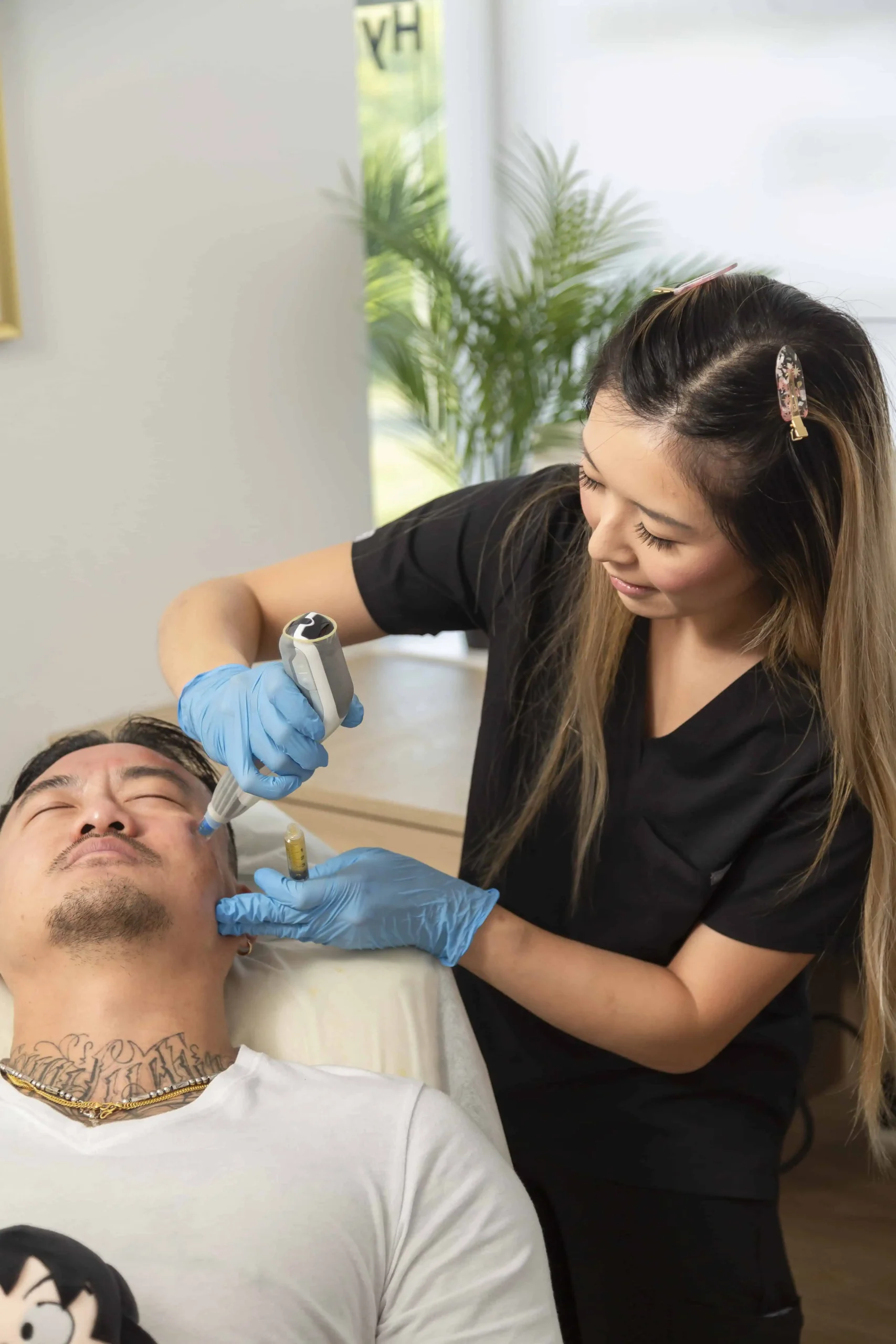 Nurse administering injectable treatment to male patient during session